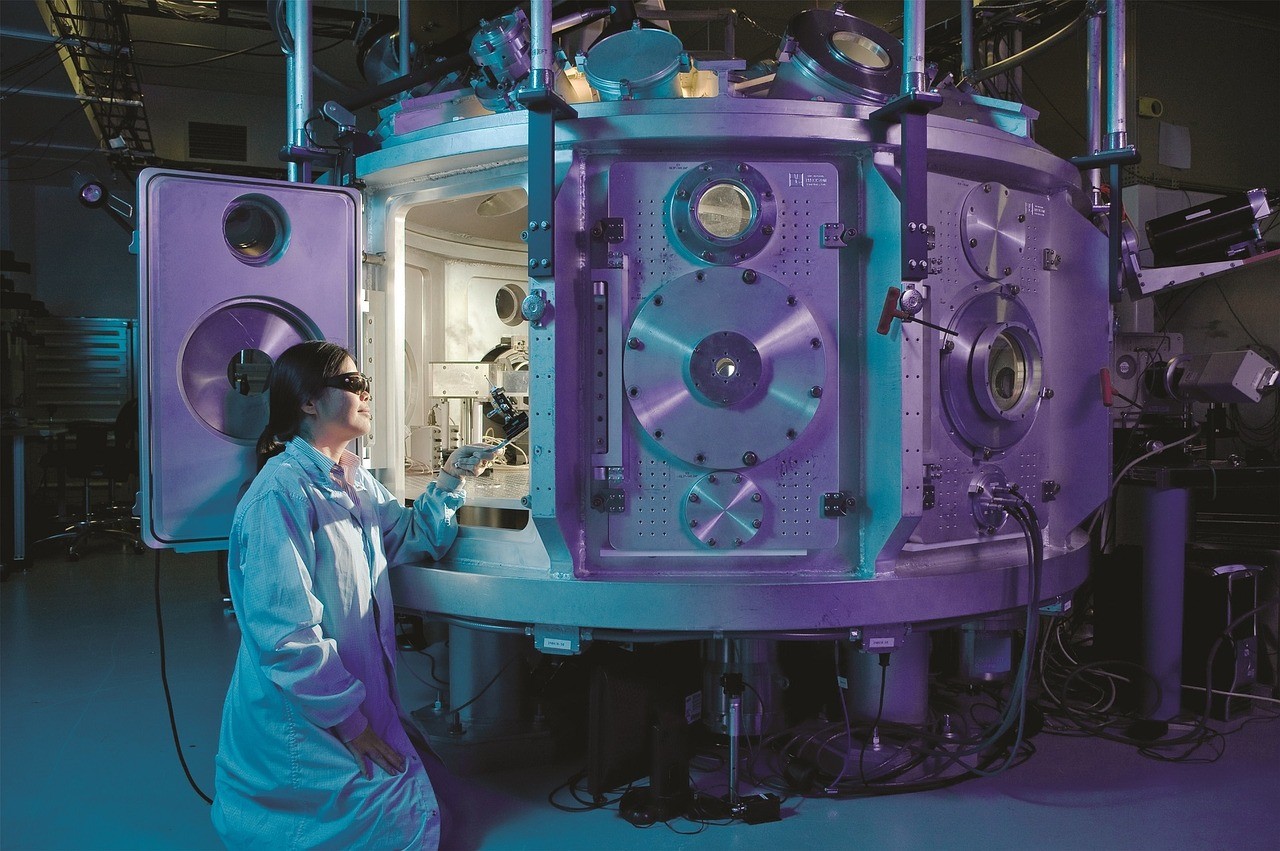 a scientist wearing goggles is working with scientific equipment